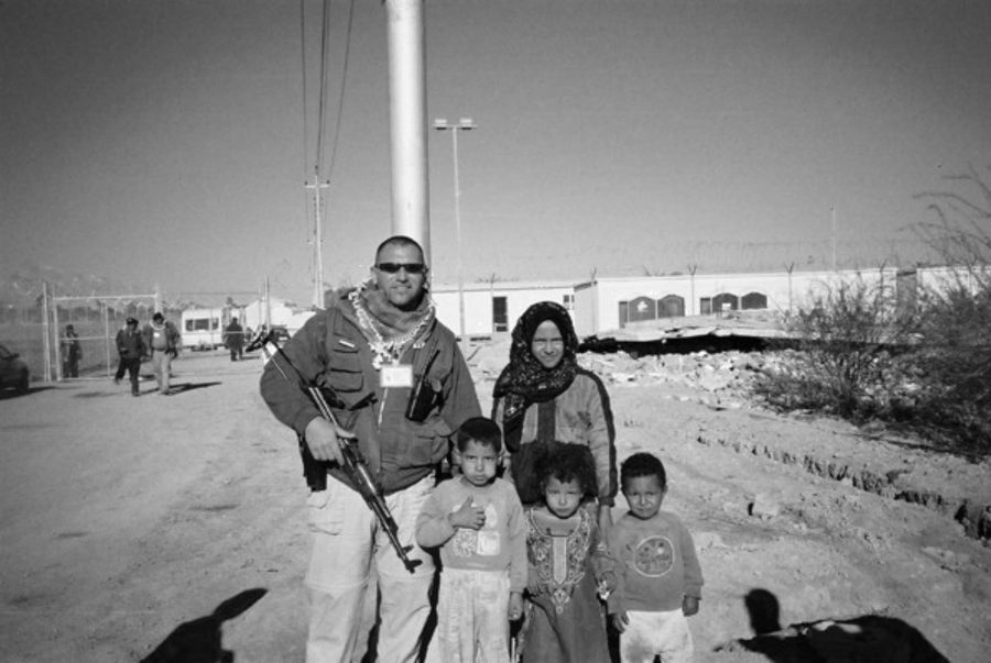 Scott White with a local family in Iraq